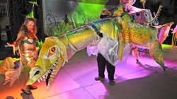 Rebecca Burg, left, of Key West, Fla., dances with her sea dragon at the 2009 Pier House Pretenders in Paradise costume contest in Key West. Entitled "Deep Sea Dating," the entry took second place in the individual professional category.